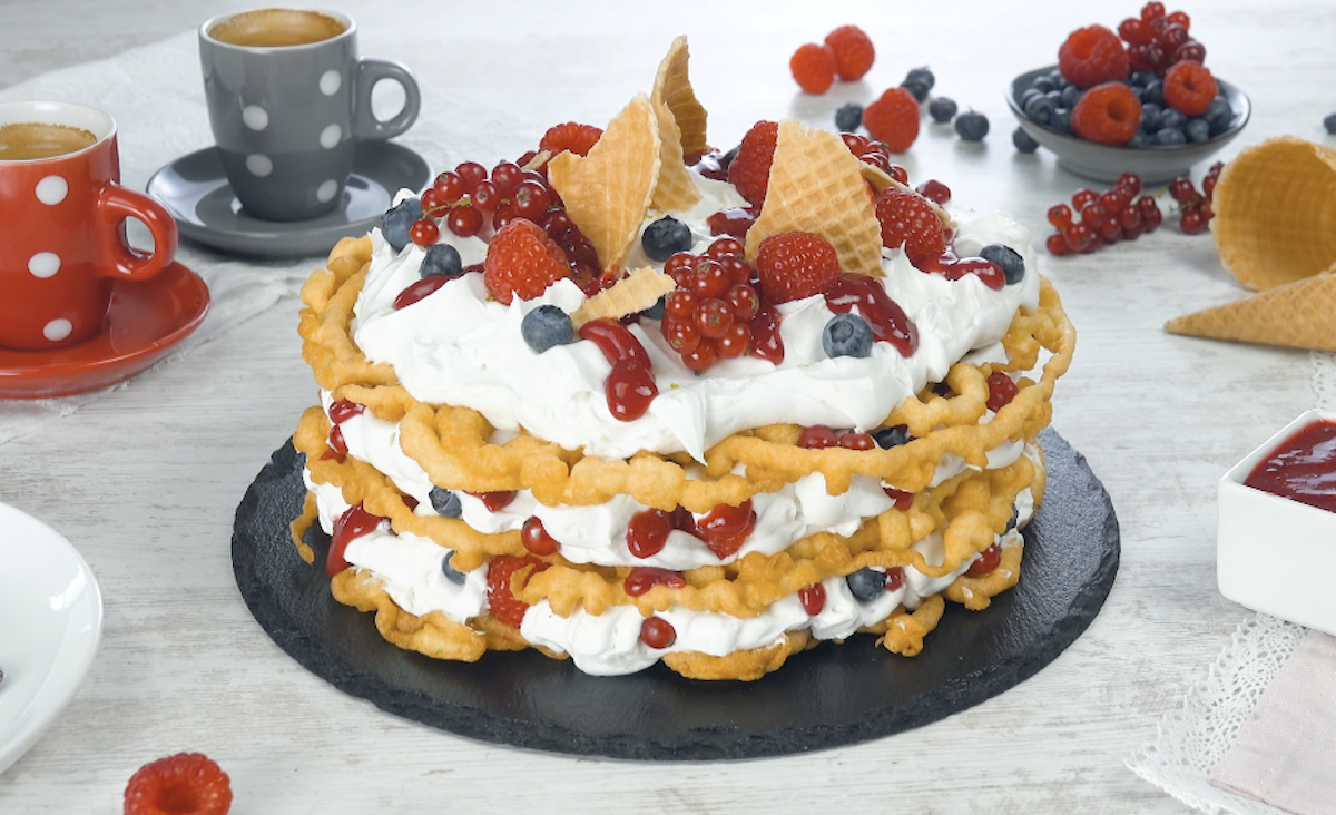 Homemade Funnel Cakes Covered With Coconut Cream And Fresh Berries
